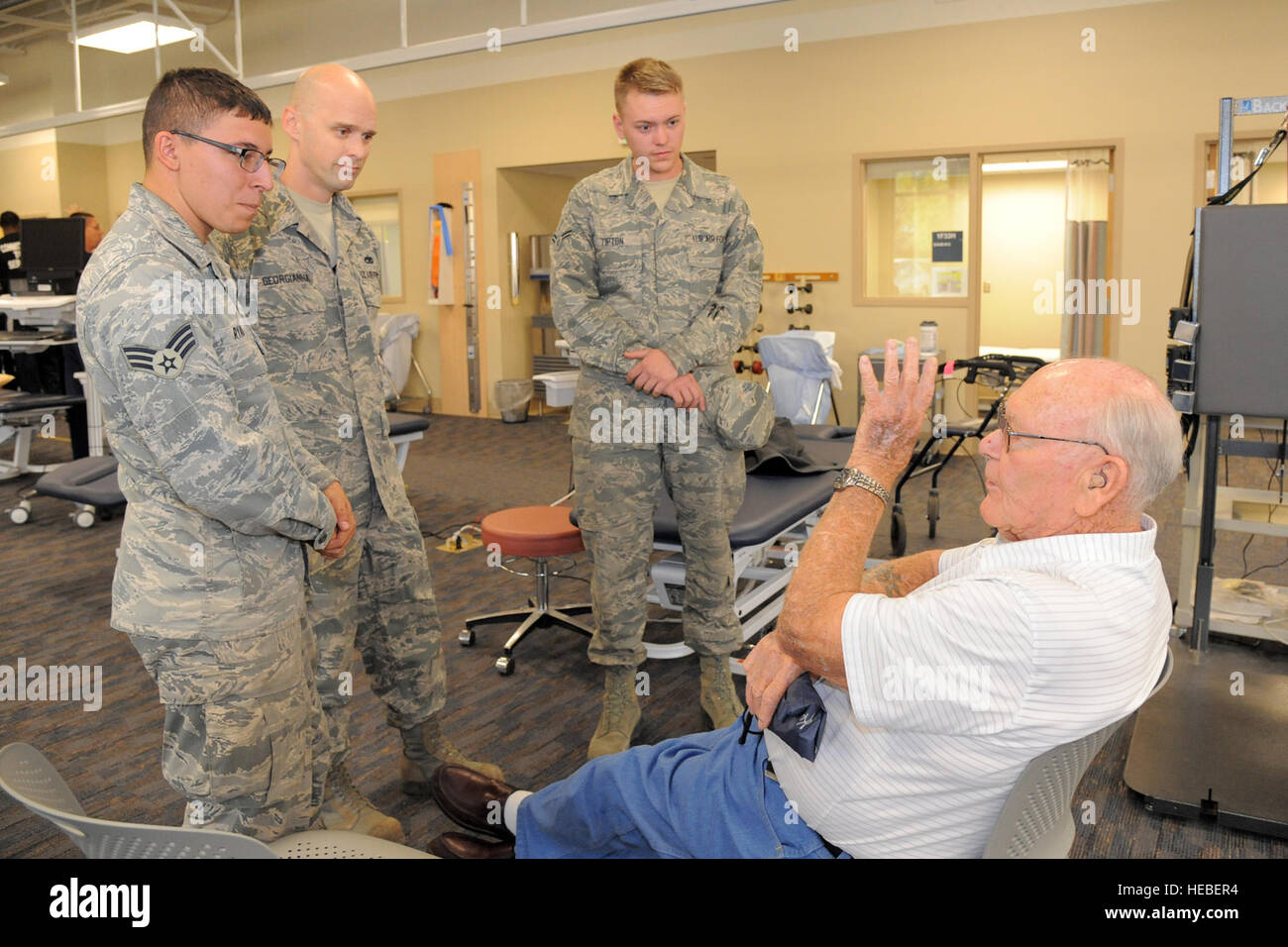 Senior Airman Pierce Ryan 729th Air Control Squadron, Tech. Sgt. Sterling Georgianna, 419th Fighter Wing, and Airman 1st Class Jerod Tipton 388th Fighter Wing, visit with Benjamine Winslow, a veteran at the George E. Wahlen Dept. of Veterans Affairs Medical Center, Salt Lake City, during a service project, Nov. 6, 2014. In honor of Veterans Day, active duty personnel from military bases around Utah, participated side-by-side with NBA players from the Utah Jazz basketball team, in several service projects at the VA Medical Center, Salt Lake City, Utah. (U.S. Air Force photo by Todd Cromar/Relea Stock Photo