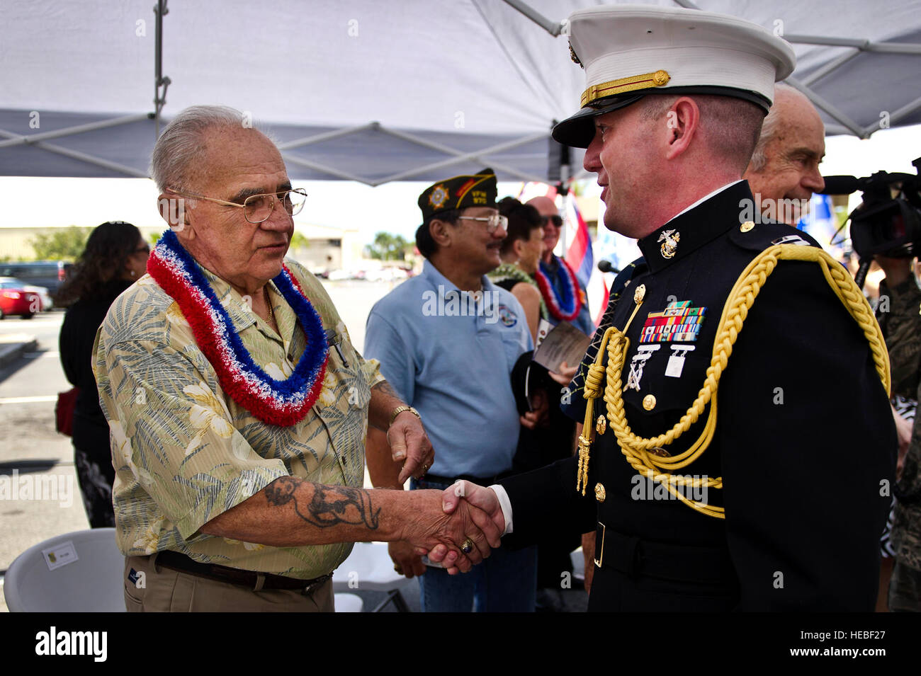 U.S. Marine Corps Capt. Mark H. Halle, Joint Prisoner of War/Missing in Action Accounting Command, Aide De Camp speaks with former Vietnam POW, retired U.S. Marine Corps Chief Warrant Officer 4 Bill Thomas, after a ceremony marking the 40th anniversary of Operation Homecoming, April 4, 2013 at Joint Base Pearl Harbor-Hickam, Hawaii. In 1973, the last Vietnam conflict prisoner of war landed at what was then Hickam Air Force Base. Thomas was captured, May 19, 1972, when during a combat mission over South Vietnam, his aircraft was shot down a few miles from Quang Tri City, South Vietnam. Thomas s Stock Photo