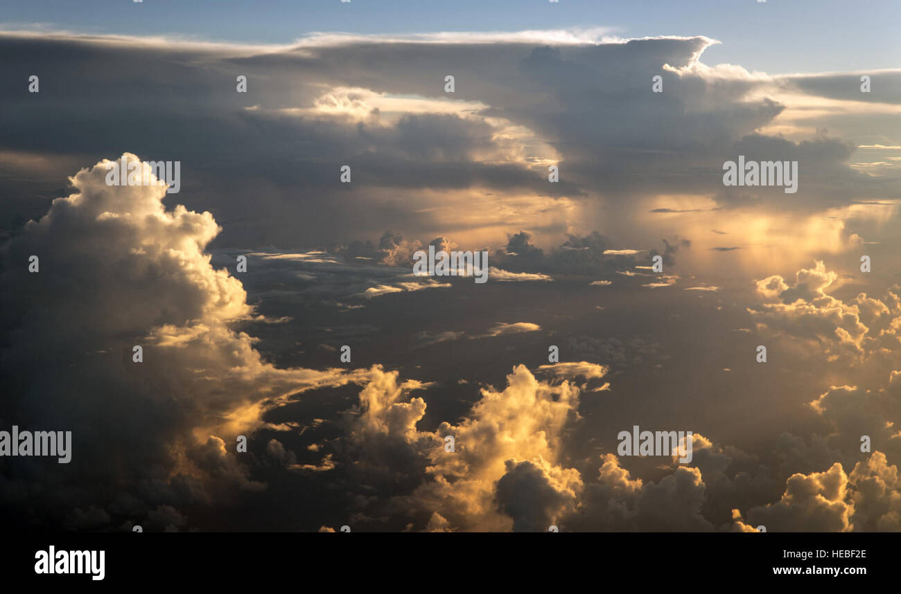 Thunderstorms and squalls are seen from the flight C-5B Galaxy above the Pacific Ocean, Aug. 14, 2014. The Air Force Reserve aircrew from the 312th Airlift Squadron, Travis Air Force Base, flying the aircraft was conducting a mobility channel mission, moving high-priority cargo and passengers among air bases in the U.S. Pacific Command area of responsibility.  (U.S. Air Force photo/Lt. Col. Robert Couse-Baker) Stock Photo