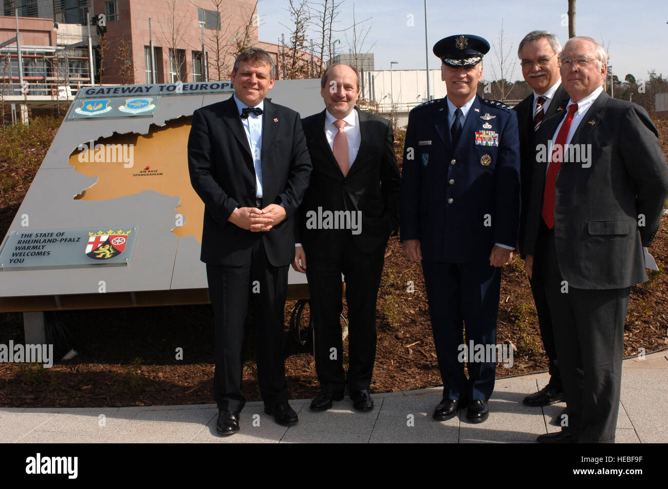 (Left to right) Mr. Volker Hoff, State of Hesse Minister for Federal and European Matters, Professor Dr. Ingolf Deubel, Minister of Finance, General Tom Hobbins, United States Air Forces in Europe commander, Mr. Karl Peter Bruch, Deputy Minister President, and Ambassador William Timken, United States Ambassador to Germany; stand by the newly dedicated monument that dubs Ramstein Air Base as the new gateway to Europe, which was previously held by Rhein-Main Air Base.(U.S. Air Force photo by Airman 1st Class Julianne Showalter)(RELEASED) Stock Photo