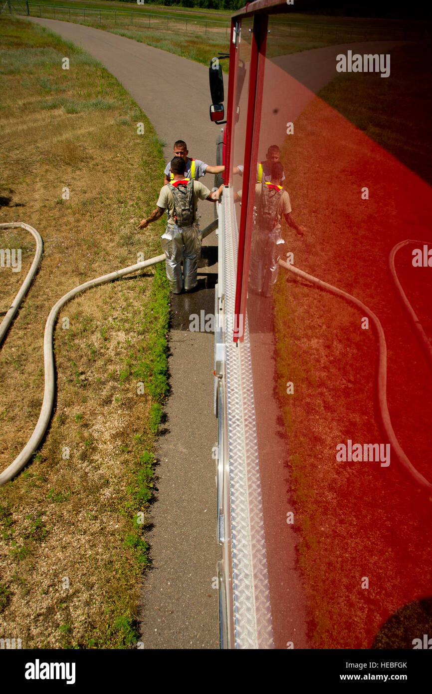 Air Force firefighters from the 910th Civil Engineer Squadron refill a ...