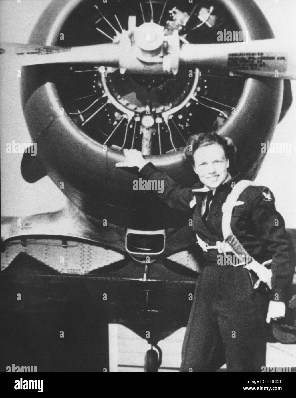 A pilot prepares for flight in an AT-6 Texan trainer aircraft ...