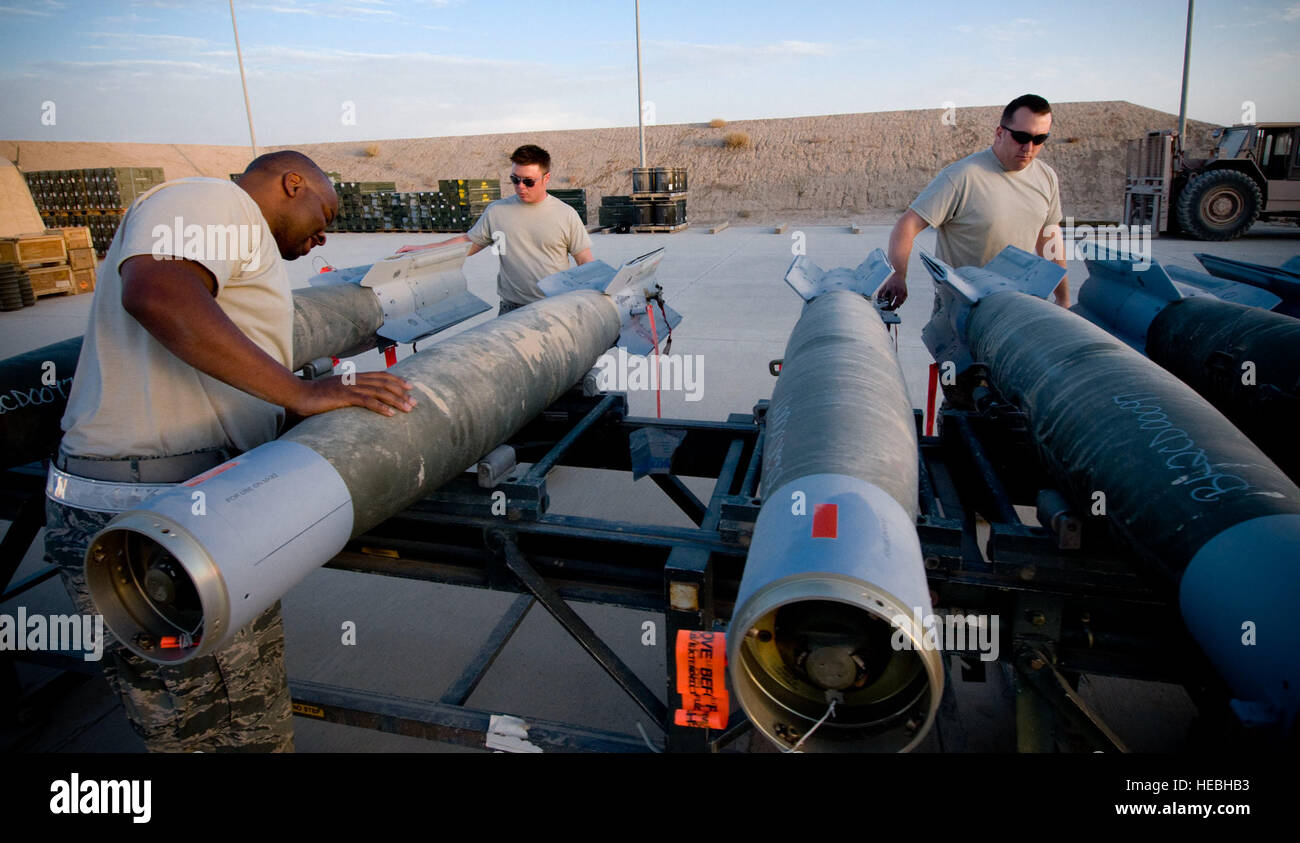 The 451st Air Expeditionary Group Logistics Flight-Ammo checks GBU-12 laser-guided bombs at Kandahar Air Field, Afghanistan, Oct. 27, 2008. The three-man team frequently handles munitions separately, delegating responsibilities to work on multiple projects, but some tasks require all three to work together to get the job done. (U.S. Air Force photo by Staff Sgt. Samuel Morse/Released) Stock Photo