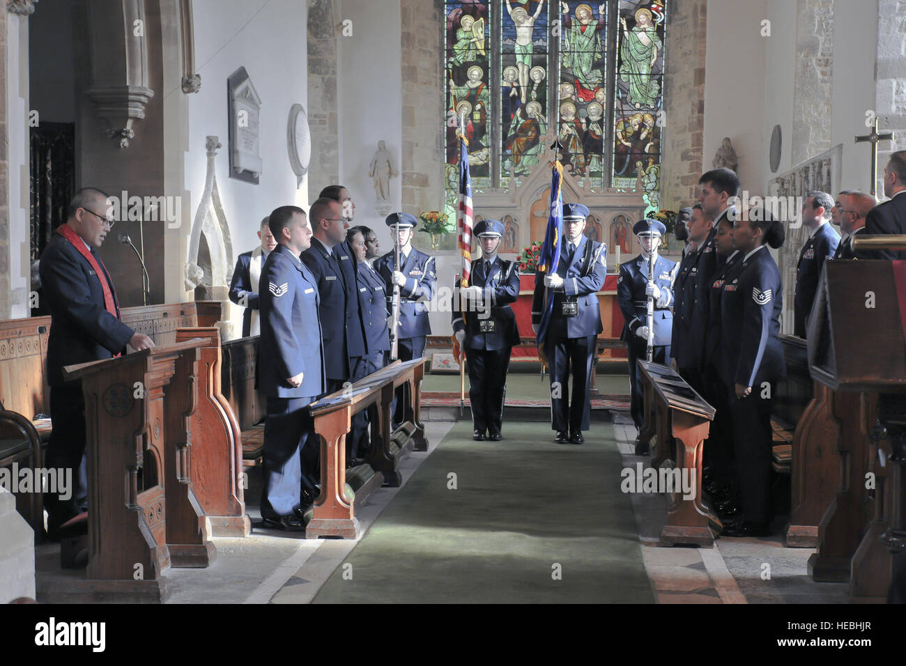 The 422nd Air Base Group Honor Guard presents the colors during the singing of the U.S. national anthem during a memorial service in the Parish Church of St. Mary Magdalene in Helmdon Nov. 2. The ceremony honored the 327th Bombardment Squadron, VIII Bomber Command, Airmen killed Nov. 30, 1943, when they left RAF Poddington on a bombing mission to Germany, and their plane crashed at Astwell Castle Farms. (U.S. Air Force photo by Staff Sgt. Brian Stives) Stock Photo