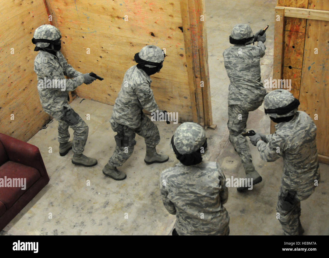 Security forces Airmen charge into a room during an active shooter ...