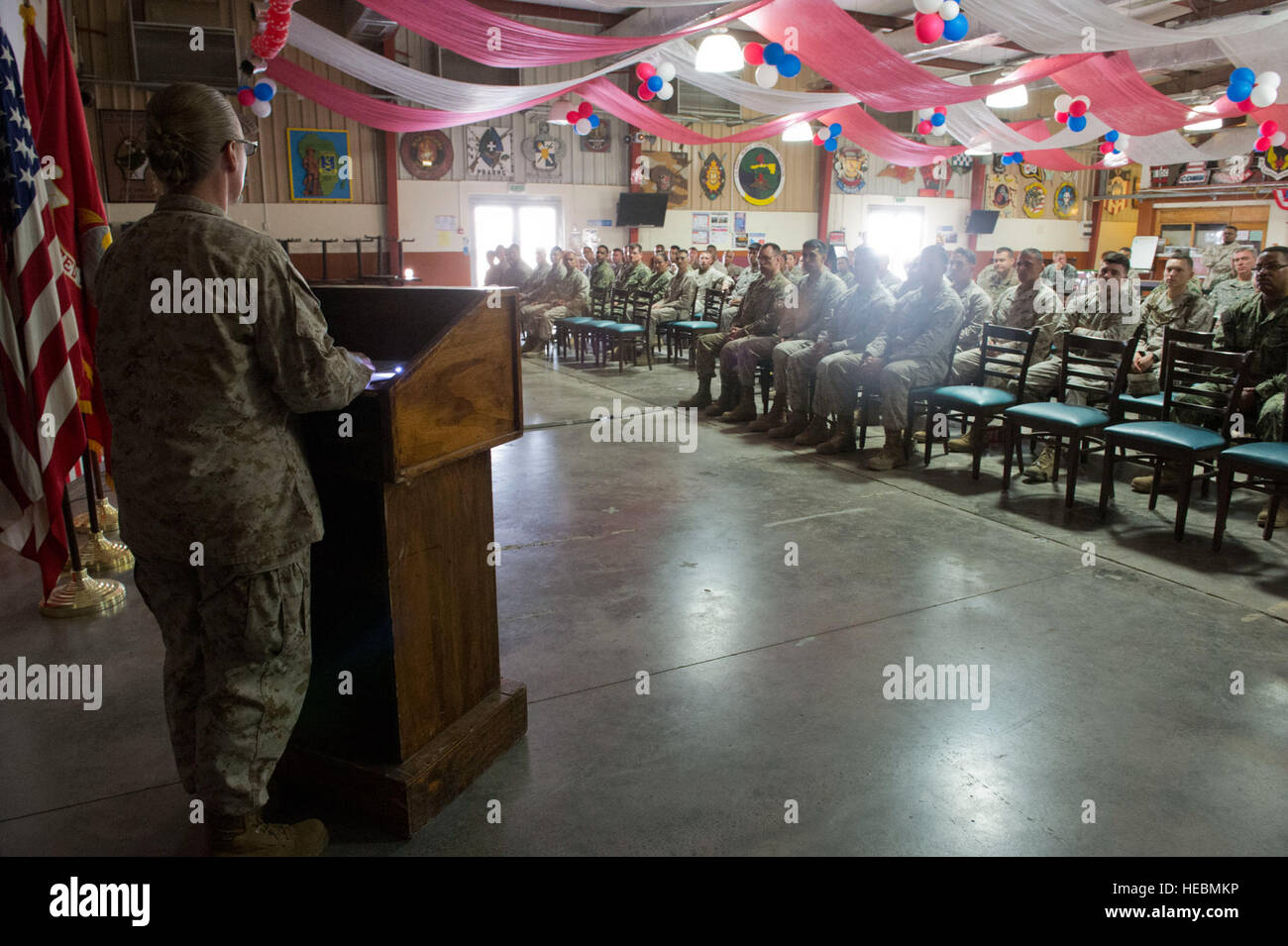 U.S. Marine Corps Sgt. Maj. Bonnie Skinner, Combined Joint Task Force-Horn of Africa, speaks to the crowd at the Marine Corp Martial Arts instructor's course graduation ceremony July 2, 2014, at Camp Lemonnier, Djibouti. Seven students graduated the 3-week long, 120-hour course and can now train students on MCMAP and move them up the belt levels. (U.S. Air Force photo by Staff Sgt. Leslie Keopka) Stock Photo