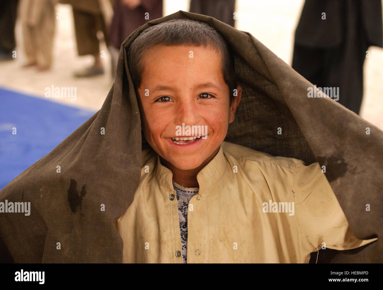 An Afghan boy poses for the camera during a shura near Forward Operating Base Bullard, Shah Joy District, Zabul province, Sept. 15, 2010. Shah Joy District Chief Abdul Qayum spoke to elders about the upcoming provincial parliamentary elections during the shura. Stock Photo