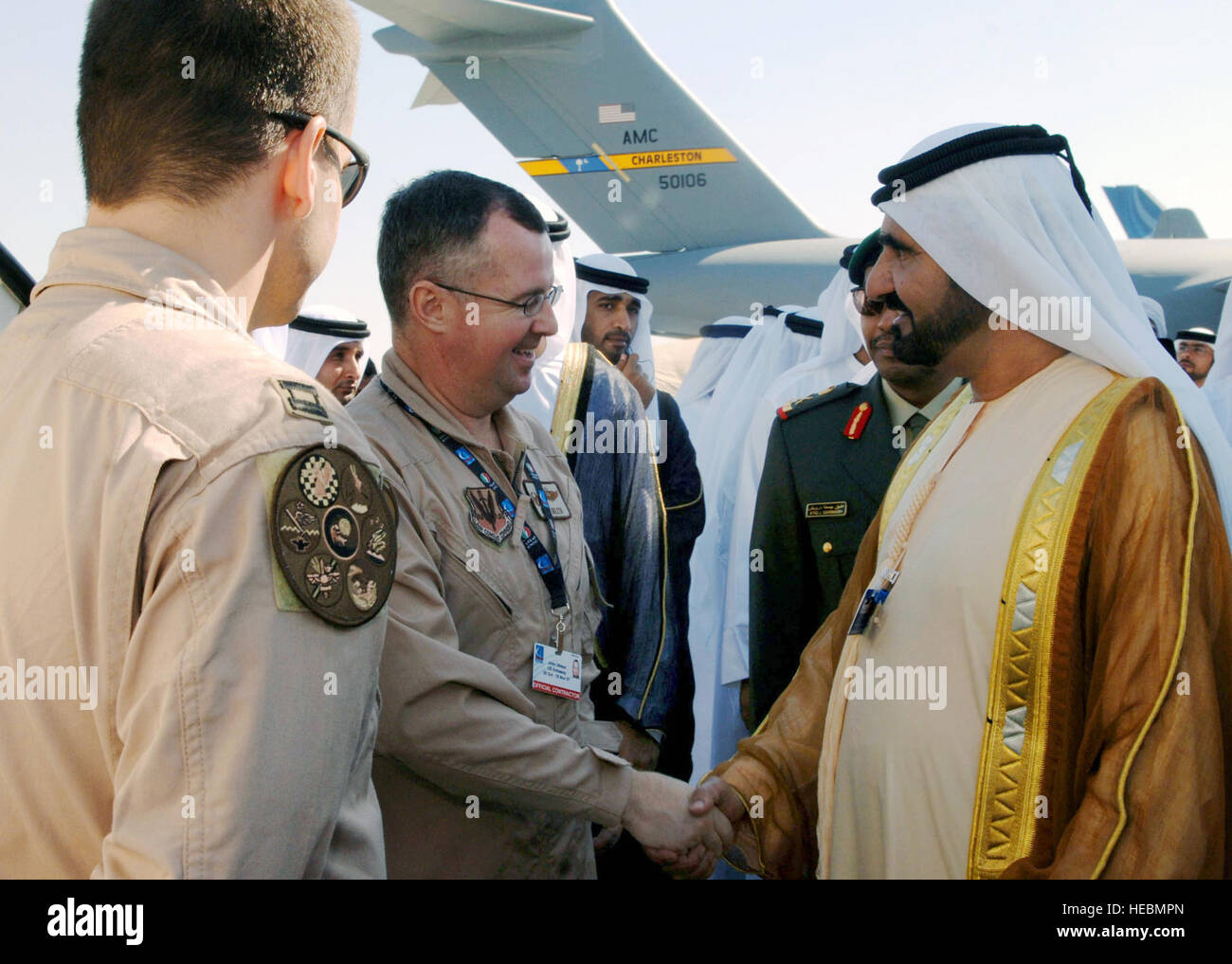 His Highness Shaikh Mohmmed bin Rashid Al Maktoum, vice president and prime minister of the United Arab Emirates and ruler of Dubai, shakes hands with Lt. Col. John Ukleya and Capt. John Dress Nov. 11 at the Dubai Air Show. Colonel Ukleya and Captain Dress are E-3 Sentry AWACS aircrew member with the 552 Air Control Wing from Tinker Air Force Base, Okla. The United States military provided support for the 10th annual Dubai Air Show Nov. 11 to 15. Approximately 300 Airman, Soldiers and Sailors, and various Air Force and Navy aircraft from bases in the Persian Gulf region and the United States e Stock Photo