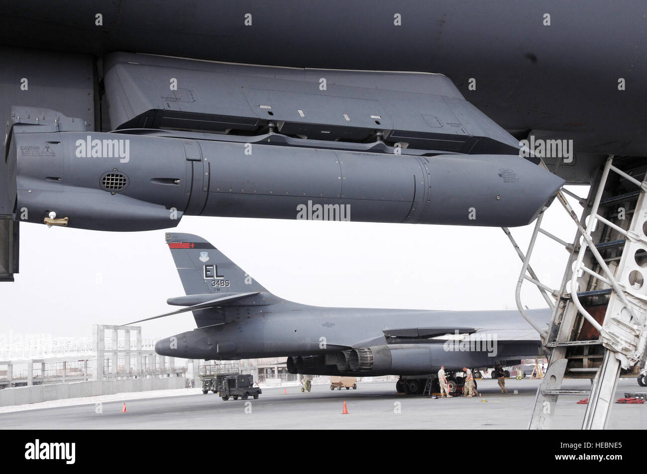 A Sniper Advanced Targeting Pod is mounted on the underside of a B-1B ...