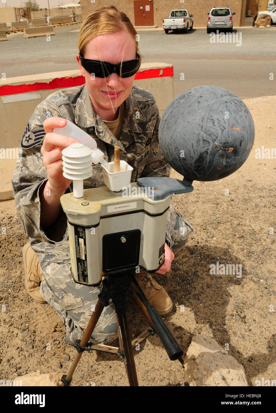 Staff Sgt. Stacy Vandenwyngaard, 386th Expeditionary Operations Support Squadron, adds distilled water to the heat stress monitor to ensure accurate Wet Bulb Globe temperature readings. The Wet Bulb Globe Temperature is a composite temperature used to estimate the effect of temperature, humidity, wind speed and solar radiation on humans, determining the heat stress category used for work/rest cycles. Sergeant Vandenwyngaard is currently deployed from Charleston Air Force Base, S.C., and is originally from Appleton, Wis. (U.S. Air Force photo/ Senior Airman Courtney Richardson) Stock Photo