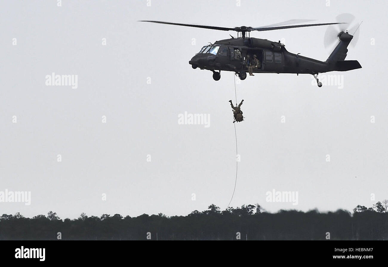 Soldiers fast rope from a UH-60 Black Hawk during Emerald Warrior 16 on ...