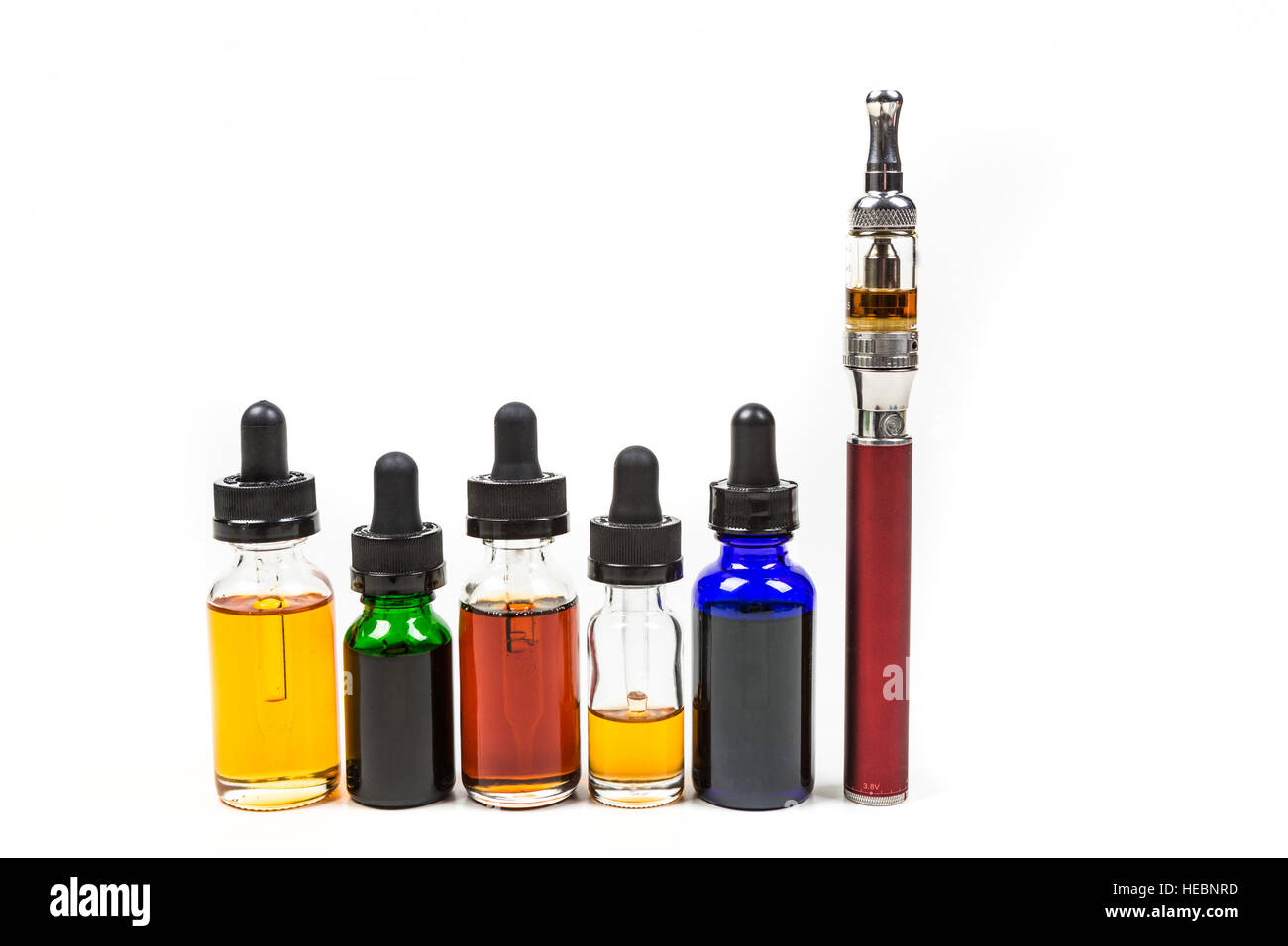 Assorted flavors of vape juice and an ecigarette isolated on white background Stock Photo