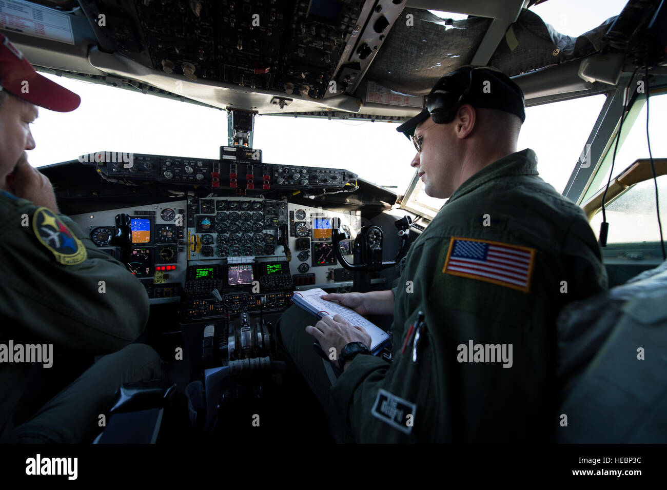 Pennsylvania Air National Guard Airmen Lt. Col. Chuck Tubbs, aircraft commander, left, and 1st. Lt Brandon Rader, right, both of the 171st Air Refueling Wing, accomplish their pre-flight checklist prior to launch of a KC-135 Stratotanker from the Combat Readiness Training Center (CRTC) flight line in Gulfport, Miss., during Exercise Southern Strike 15 (SS15), Oct. 28, 2014. SS15 is a total force, multiservice training exercise hosted by the Mississippi National Guard's CRTC from Oct. 27 through Nov. 7, 2014. The SS15 exercise emphasizes air-to-air, air-to-ground and special operations forces t Stock Photo