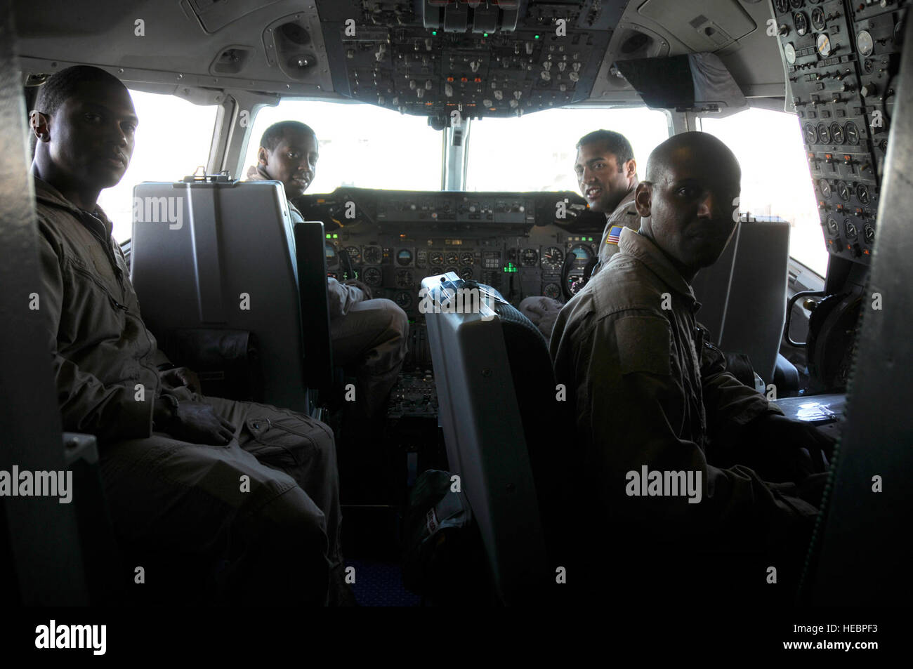 Staff Sgt. Michael Smith, Capt. Jon Cato, 1st Lt. Jason Brown and Tech Sgt. Elton Phew. 908th Expeditionary Air Refueling Squadron, KC-10 Extender crew, prepare for a historical flight, Feb. 29. The all black crew flew together in celebration of African-American History Month paying tribute to the Tuskegee Airmen that paved the way. Sergeant Smith is deployed from McGuire Air Force Base, N.J., and hails from Baltimore, Md. Cato is deployed from Travis AFB, Calif., and hails from Raleigh, N.C. Brown is deployed from McGuire AFB, N.J., and hails from Arvada, Colo. Phew is deployed from McGuire A Stock Photo
