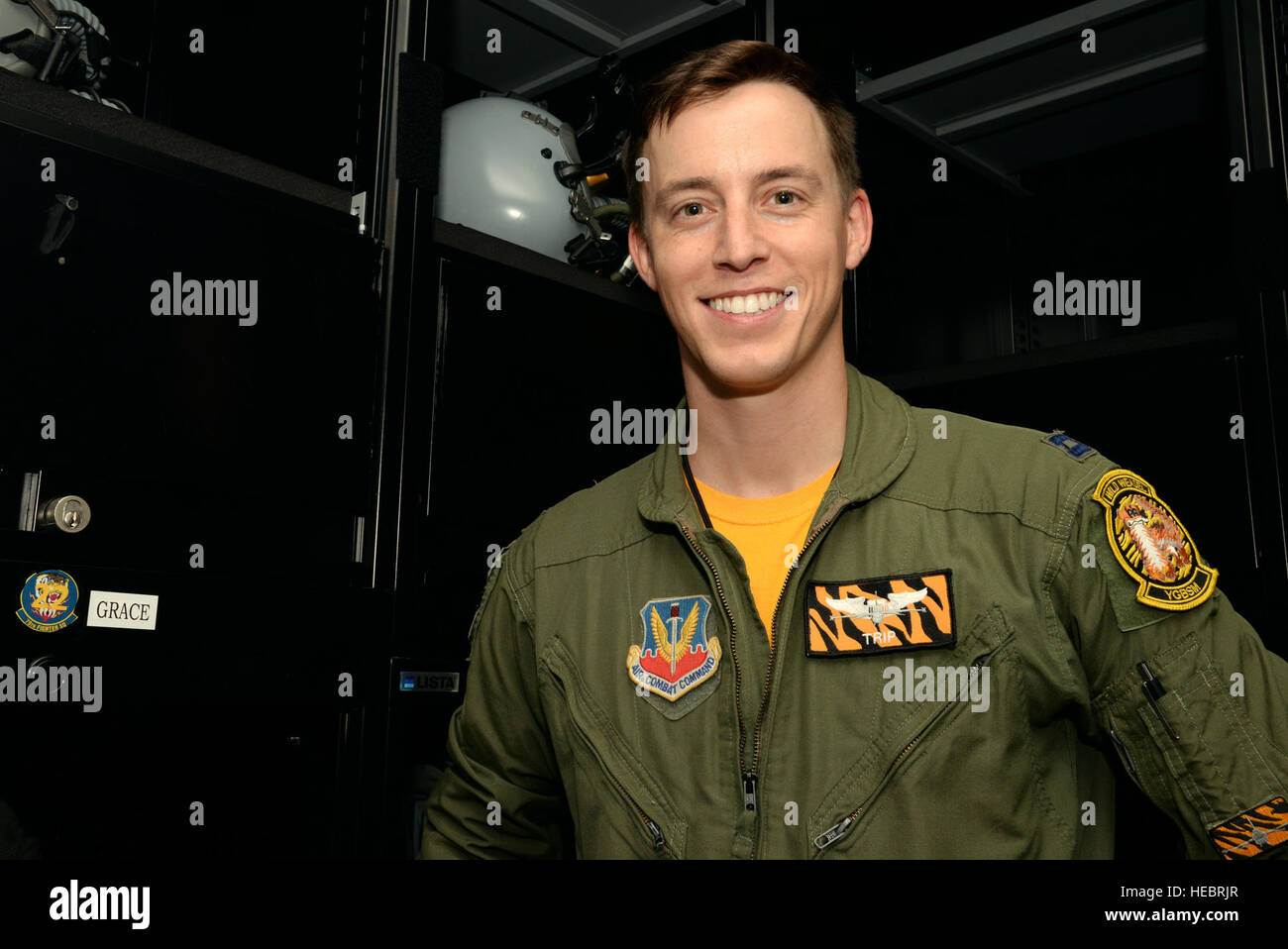 U.S. Air Force Capt. Stephen Grace, 79th Fighter Squadron fighter pilot, stands by his locker in the 79th FS locker room at Shaw Air Force Base, S.C., Oct. 3, 2014. Grace, an Air Force Academy, Colorado Springs, Colo., graduate, attributes his ongoing success in the Air Force to his competitiveness developed from his swimming career. (U.S. Air Force photo by Airman 1st Class Jonathan Bass/Released) Stock Photo