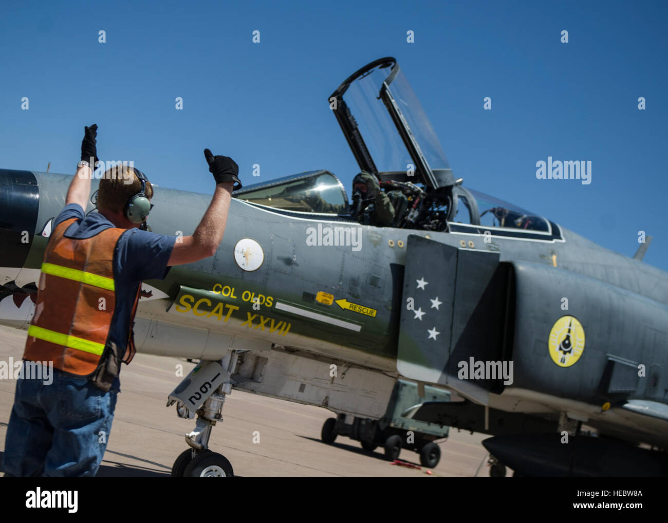 Lt. Col. Ronald King, 82nd Aerial Target Squadron, Detachment 1 commander and Mike Fogle, QF-4 Drone mechanic, go through a pre-flight checklist June 3, 2015 at Holloman Air Force Base, N.M. King flew his first solo flight in the QF-4 Drone on June 3, making him the last pilot who will ever learn to fly the QF-4. At Holloman, QF-4s can be flown either manned or unmanned and are used as remotely controlled unmanned targets for air-to-air and ground-to-air weapons systems evaluations, development and testing.  (U.S. Air Force photo by Airman 1st Class Emily A. Kenney/Released) Stock Photo