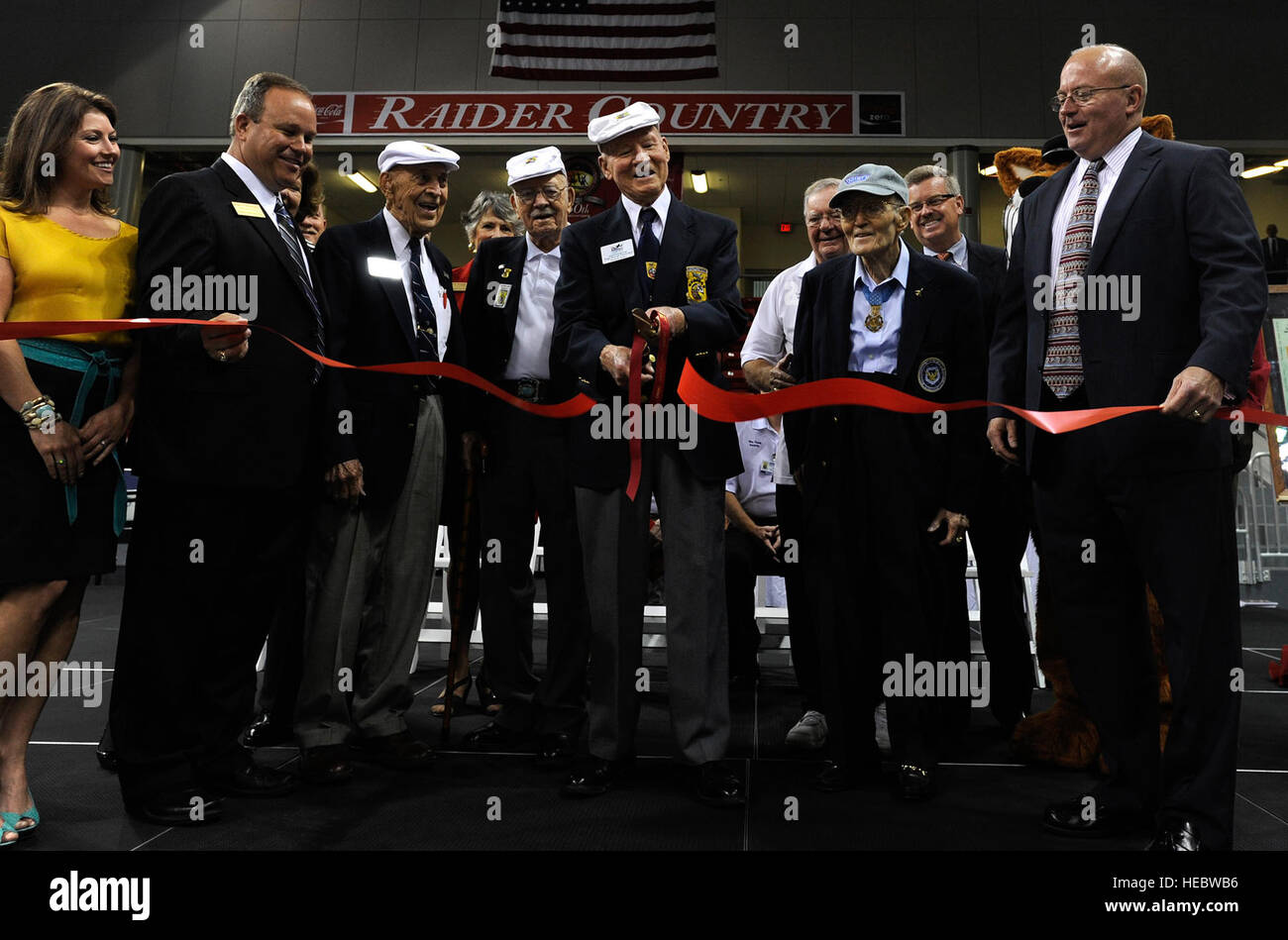 A ceremonial ribbon is cut to open the Doolittle Raider Exhibit at ...
