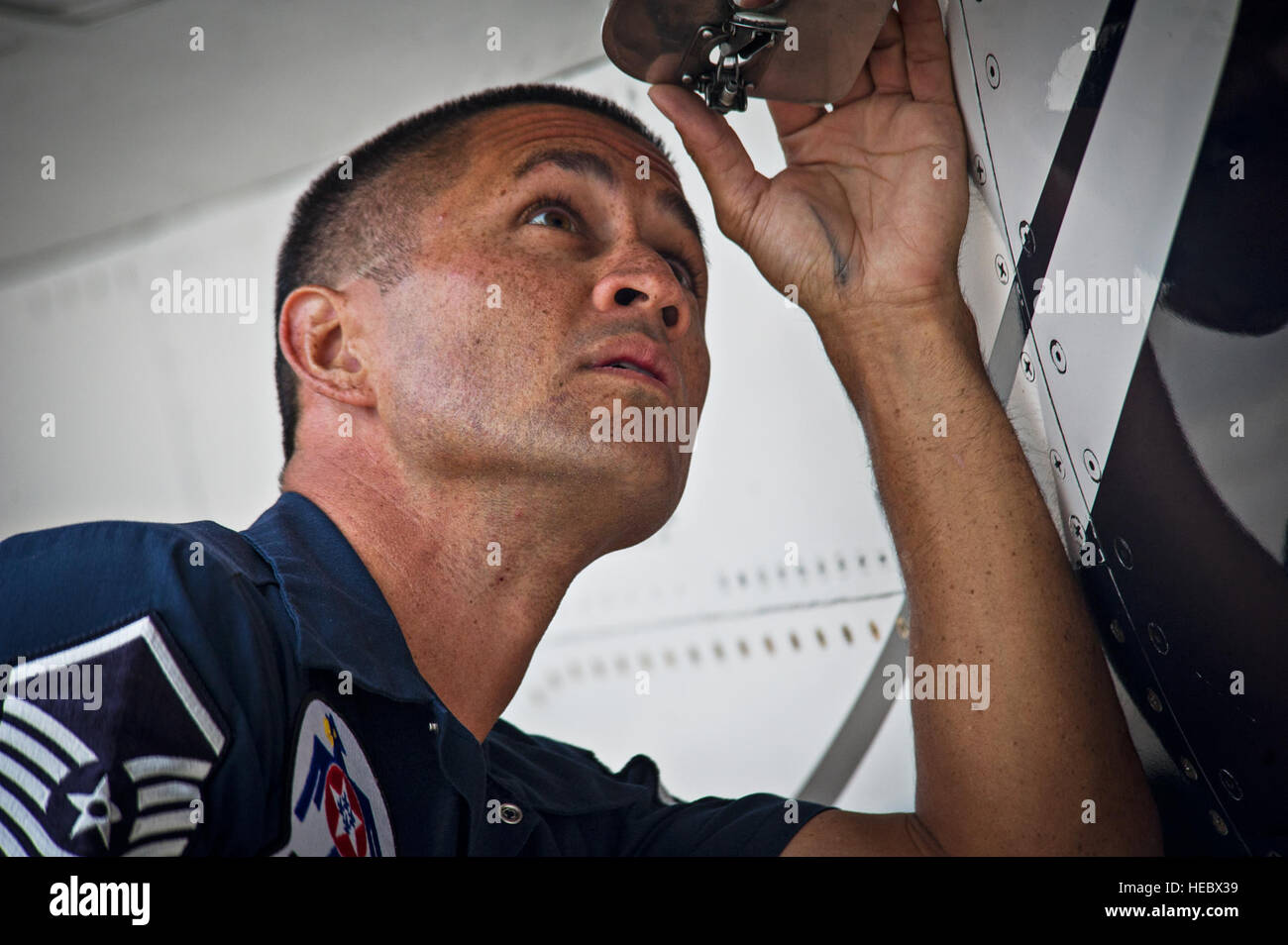 Master Sgt. Christopher Huntington, an aircraft fuels system specialist, performs checks on Thunderbirds F-16s in preparation for a practice show launch, at Fort Worth, Texas, Oct. 23, 2014. (U.S. Air Force photo/Tech. Sgt. Manuel J. Martinez) Stock Photo