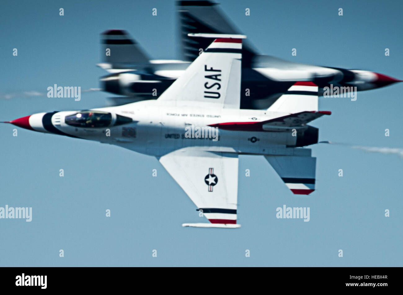 The Thunderbirds Solo pilots perform the Opposing KnifeEdge Hit