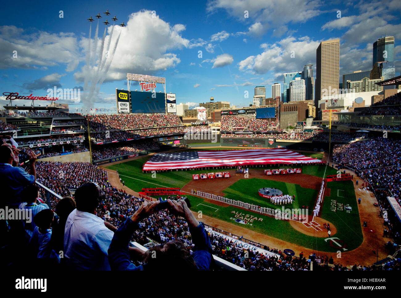 The U.S. Air Force Thunderbirds perform the flyover during the national anthem at the MLB All-Star Game, Minneapolis, Minn., July 15, 2014. (U.S. Air Force photo/Master Sgt. Stan Parker) Stock Photo