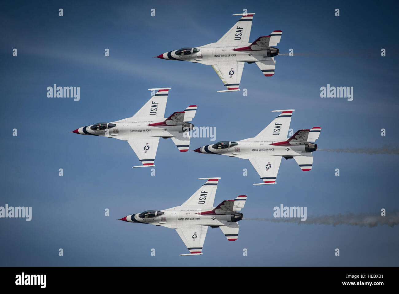 The U.S. Air Force Thunderbirds perform the Diamond Pass and Review during their performance at the Wings of Freedom Open House and Air Show, Altus Air Force Base, Okla., Sept. 13, 2014. (U.S. Air Force photo/Master Sgt. Stan Parker) Stock Photo