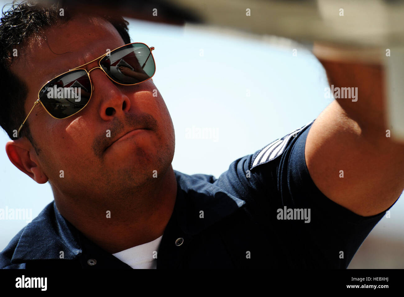 Staff Sgt. Nicanor Garcia, an avionics systems specialist, wipes down his  aircraft upon arrival to Travis Air Force Base, Calif., for the Thunder  Over Solano air show, May 1, 2014. (U.S. Air