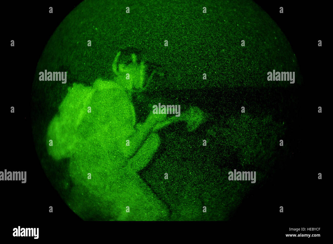 A Djiboutian army soldier kneels at his post during a night vision goggle class in Arta, Djibouti, on March 25, 2012. The U.S. Army's 3rd Squadron, 124th Cavalry Regiment, deployed in support of Combined Joint Task Force - Horn of Africa (CJTF-HOA), is helping train Djiboutian army soldiers for an upcoming deployment to Somalia. Stock Photo