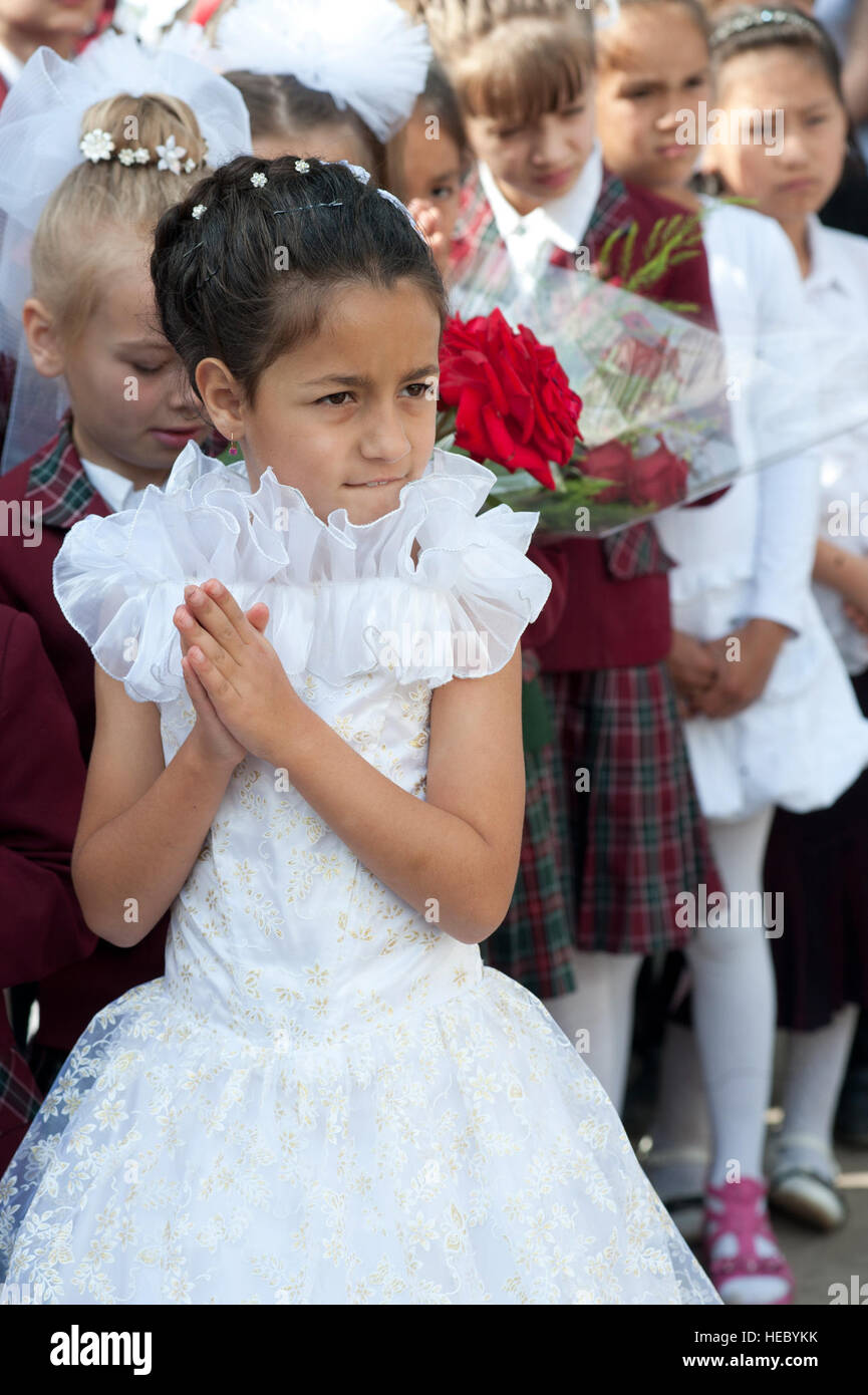 Children dress in formal attire to attend a graduation ceremony at Birdik Village School Kyrgyzstan May 25 2013. The school was renovated in 2009 as part of a humanitarian assistance project by