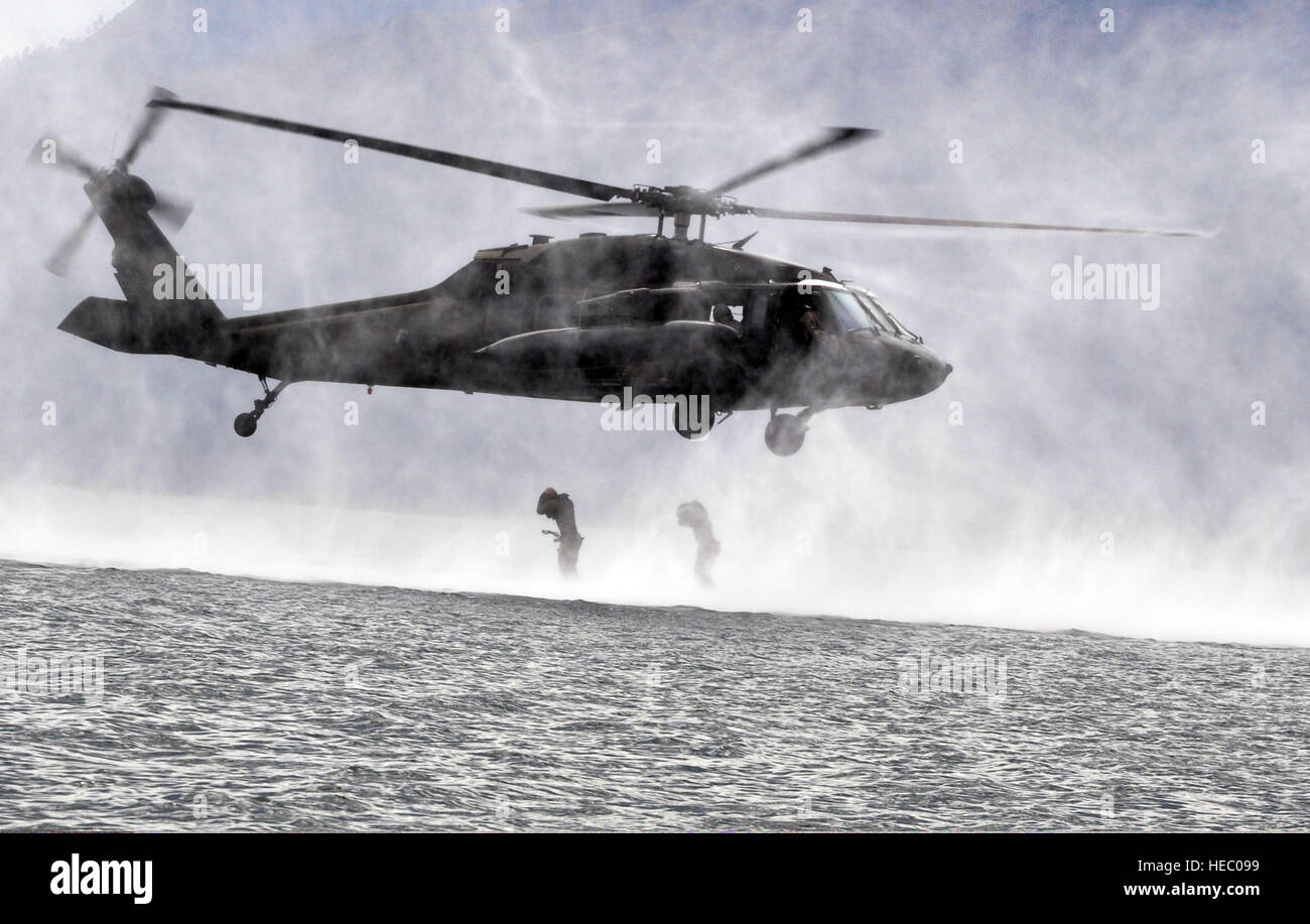 Two U.S. Service members with Joint Task Force-Bravo jump from a U.S ...