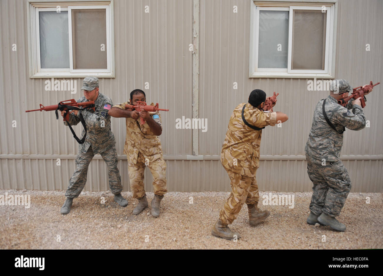 Airmen and partner nation military personnel conduct tactical movements ...