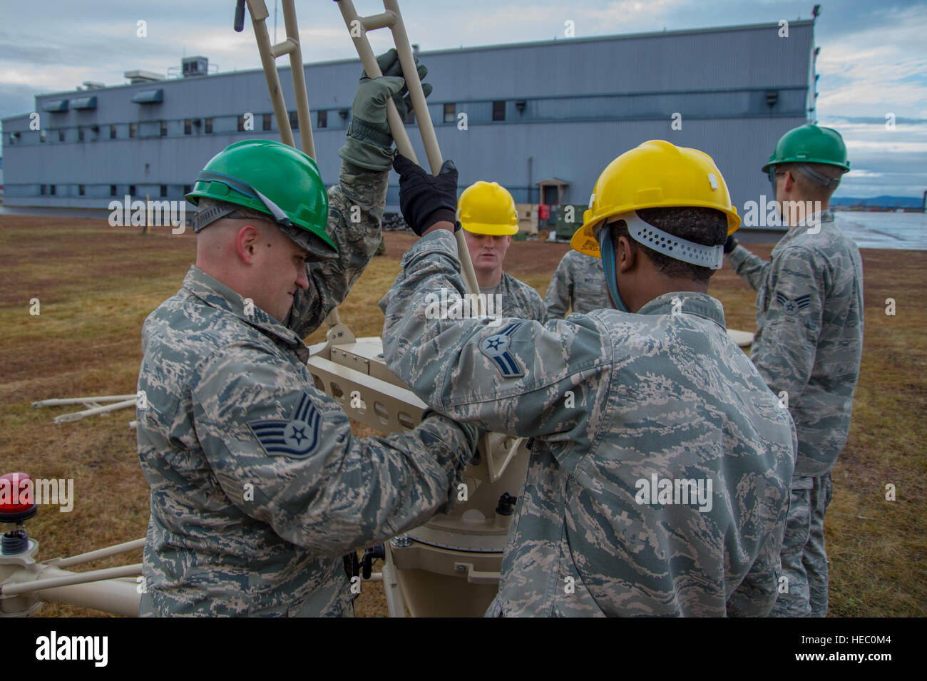 U.S. Airmen with the 52nd Combat Communications Squadron build a ground