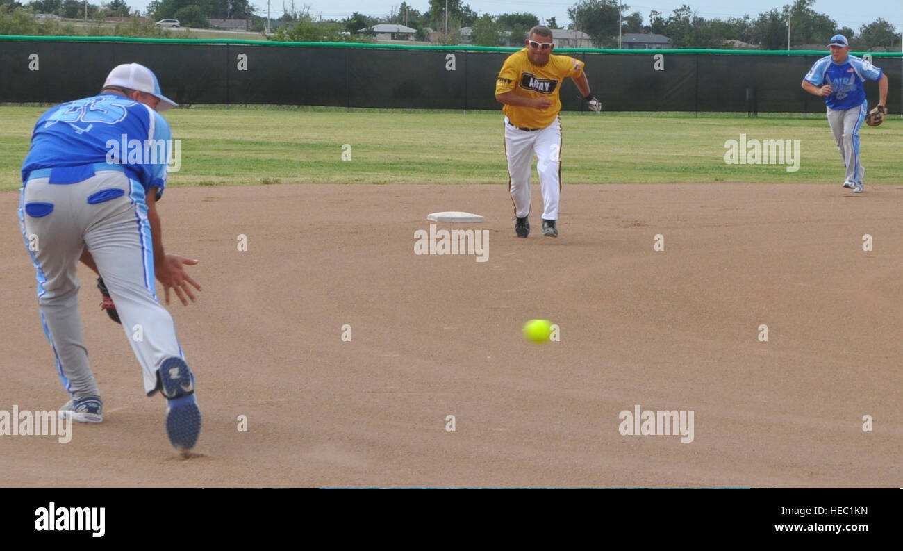 Air Force third baseman Christopher Blast lowers his glove to scoop up