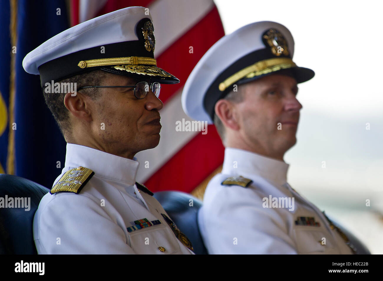 U.S. Navy Adm. Cecil D. Haney (left), incoming U.S. Pacific Fleet commander, and U.S. Navy Adm. Jonathan W. Greenert, chief of Naval Operations, listen as Navy Adm. Patrick Walsh (not pictured), outgoing U.S. Pacific Fleet commander, gives a speech during the U.S. Pacific Fleet change of command ceremony at Joint Base Pearl Harbor-Hickam Jan. 20, 2012, in Honolulu, Hawaii. Stock Photo