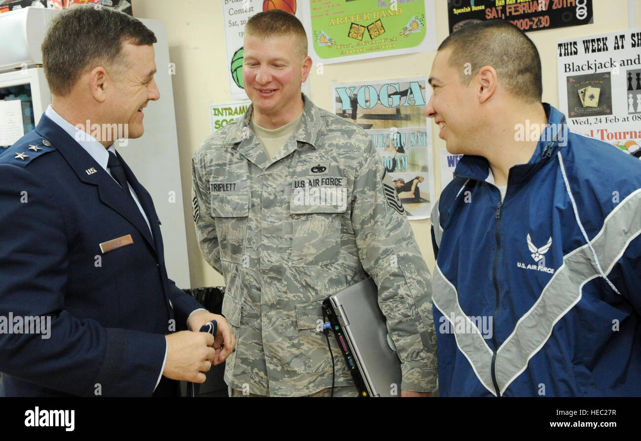 Maj. Gen. Burton M. Field, Senior Military Adviser to the U.S. Special  Representative for Afghanistan and Pakistan Ambassador Richard Holbrooke,  speaks with Master Sgt. Todd Triplett and Tech. Sgt. Ricardo Cabezas during