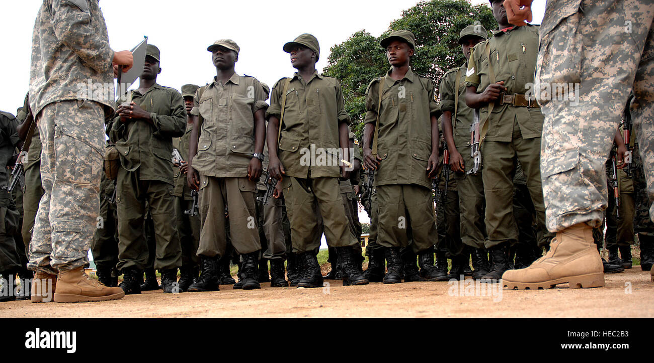 Uganda Army soldiers stand in formation before being released to begin their land navigation course taught to them by U.S. Army Soldiers from 3rd Platoon, Delta Company, 1st Battalion, 3rd Infantry Regiment, The Old Guard, Fort Myers, Virginia, on February 12, 2008 at Forward Operating Location Kasenyi, Uganda. The Ugandan Soldiers are given a compass and a map and are then expected to go out and find five markers in the field. Soldiers from The Old Guard are tasked with training the Ugandan Soldiers during a 16 week Military to Military training school located at Forward Operating Location Ka Stock Photo