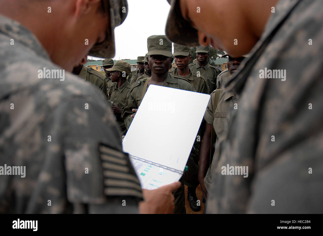 Soldier Using Compass Ugandan Army soldiers begin a land navigation course using compass and ...