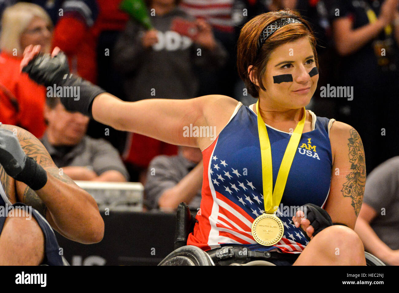 160511-F-WU507-108: Air Force Staff Sgt. Sebastiana Lopez-Arellano, Team US, stretches and smiles after U.S. Vice President Joe Biden presents her a gold metal, for winning the US versus Denmark wheel chair basketball gold metal match at the 2016 Invictus Games, at the ESPN Wide World of Sports complex at Walt Disney World, Orlando, Fla., May 11, 2016. The US beat Denmark 28-19, and took gold; Denmark took silver and the bronze went to the UK, who beat Australia 47-4. (U.S. Air Force photo by Senior Master Sgt. Kevin Wallace/RELEASED) Stock Photo