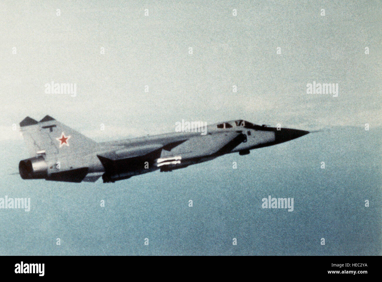 An air-to-air right side view of a Soviet MiG-31 Foxhound aircraft. Stock Photo