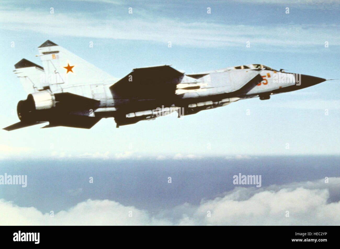An air-to-air right side view of a Soviet MiG-31 Foxhound aircraft. Stock Photo