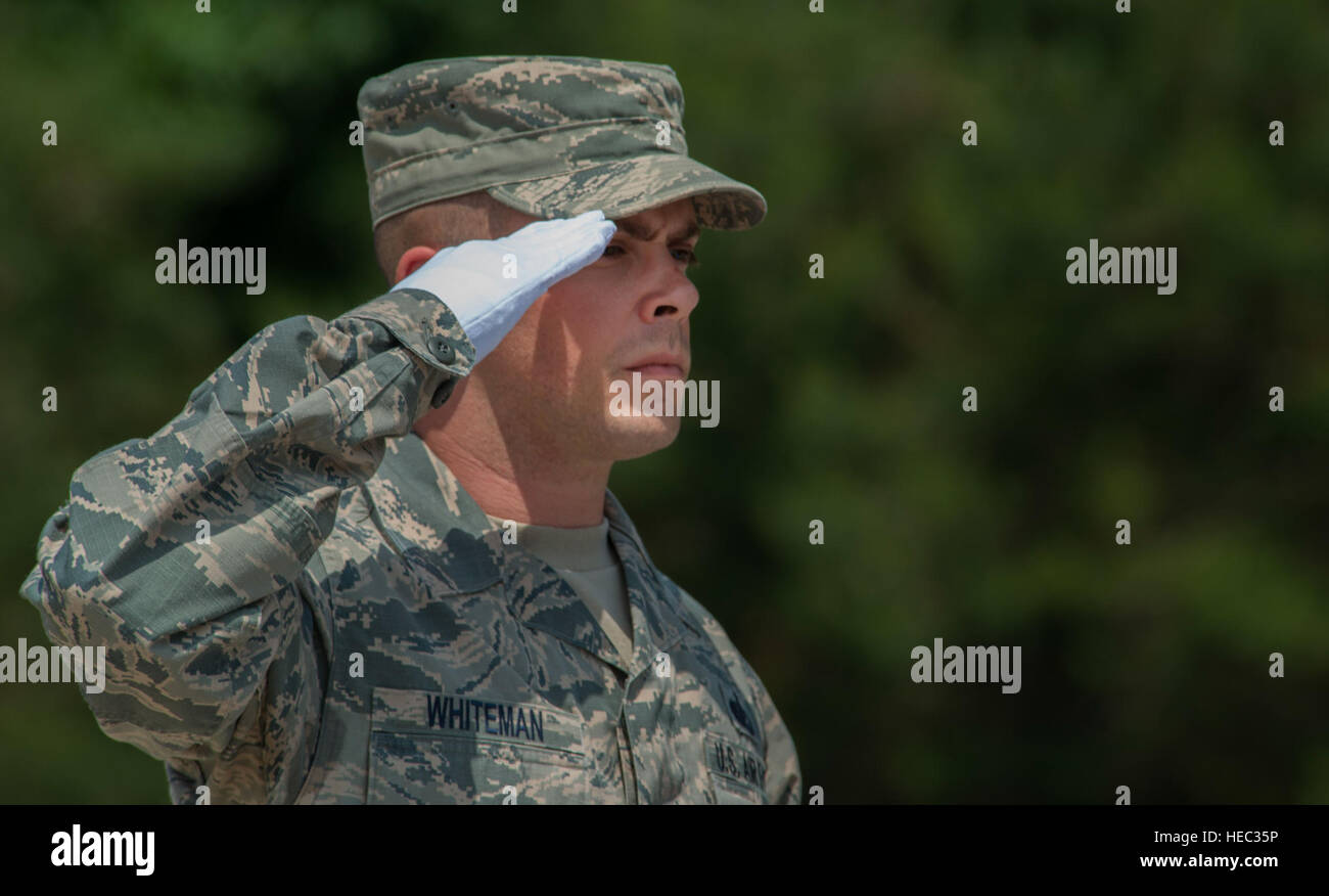 Tech. Sgt. Daniel Whiteman, 786th Force Support Squadron NCO in charge of base honor guard, salutes during a funeral ceremony demonstration as a part of the Air Education and Training Command’s Class 5 Basic Protocol, Honors and Ceremonies Course graduation June 9, 2016, at Ramstein Air Base, Germany. Members of the Air Force Honor Guard Mobile Training Team taught the course for Honor Guard Airmen across U.S. Air Forces in Europe. The graduates completed 80 hours of training in pallbearing, firing party, colors and maintenance and wear of the ceremonial uniform. (U.S. Air Force photo/Airman 1 Stock Photo