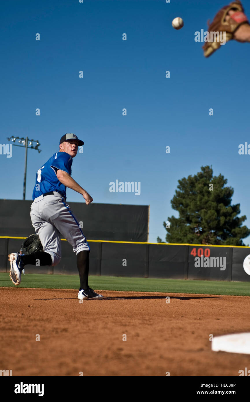 David Baska, U.S. Air Force Academy 'Falcons' sophomore, tosses a ball into the glove of the second baseman during infield practice before a game against the University of Nevada, Las Vegas 'Rebels',  April 20, 2012, at Earl E. Wilson Stadium, in Las Vegas, Nev. Baska is also the punter for the Air Force Academy's football team. Stock Photo