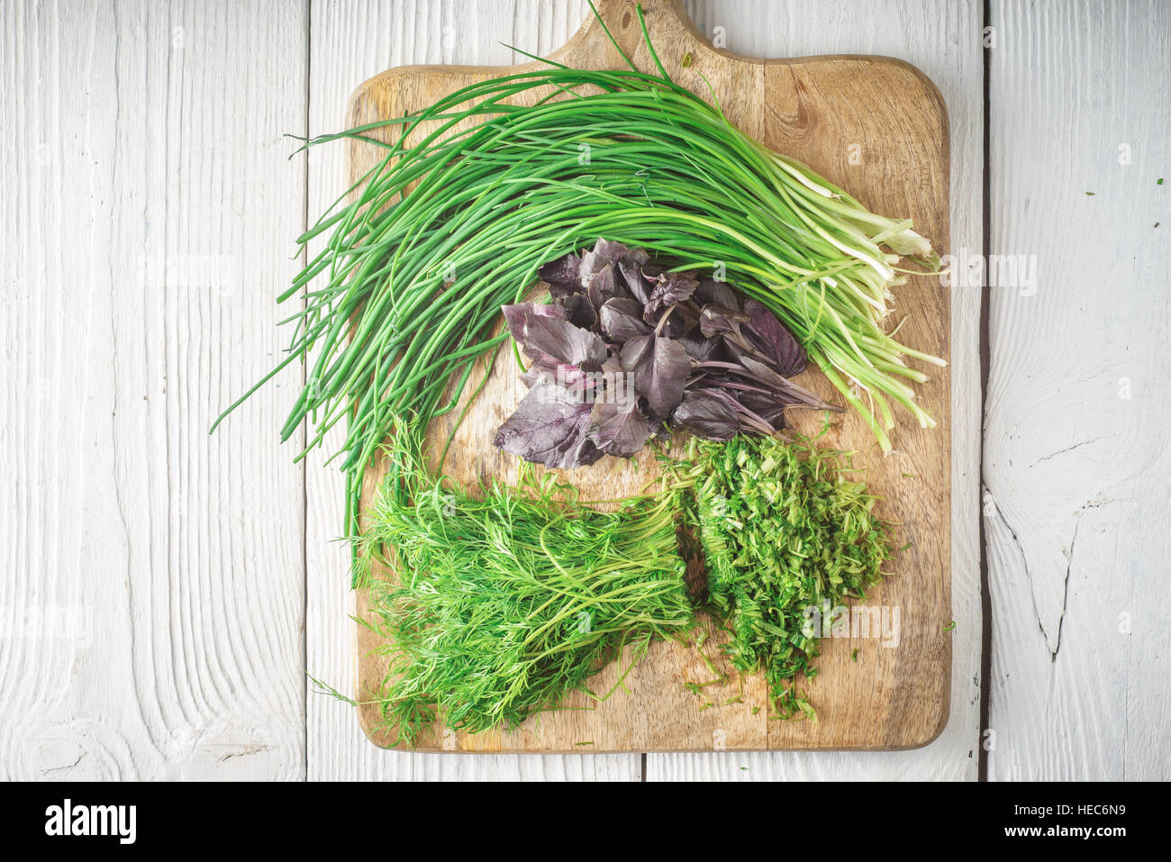 Basil, onion, dill on cutting board horizontal Stock Photo Alamy