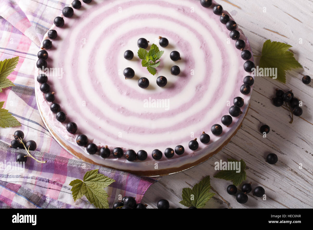 Round striped currant cheesecake close-up on the table. horizontal Stock Photo