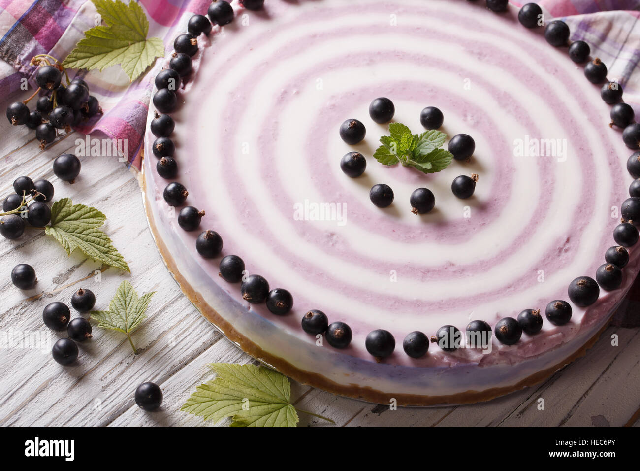 Beautiful striped currant cheesecake close-up on a plate. horizontal Stock Photo