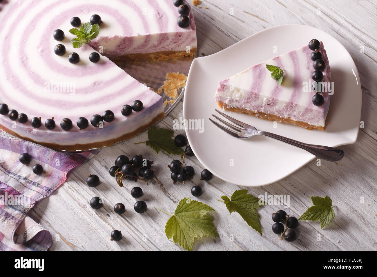 Beautiful cheese cake with currants close-up on the table. horizontal view from above Stock Photo