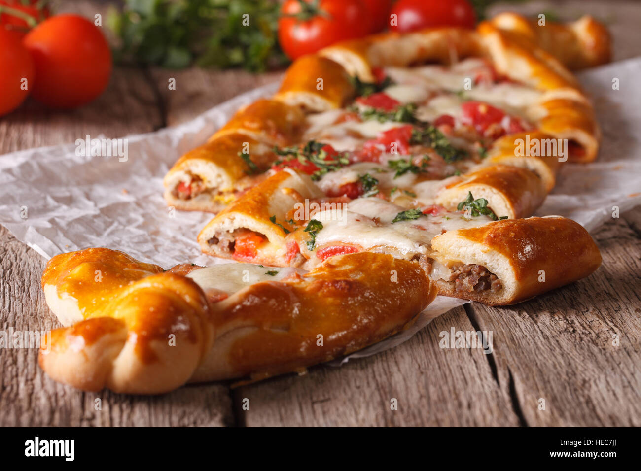 Sliced pie Turkish pide close up on the table and ingredients. Horizontal Stock Photo