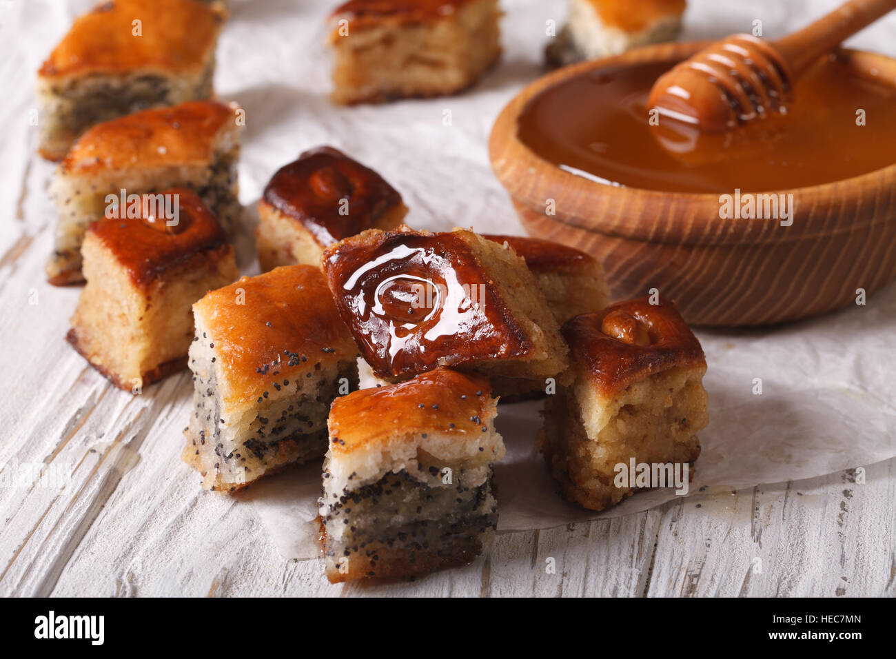 Baklava Honey with poppy seeds and nuts close-up on the table. horizontal Stock Photo