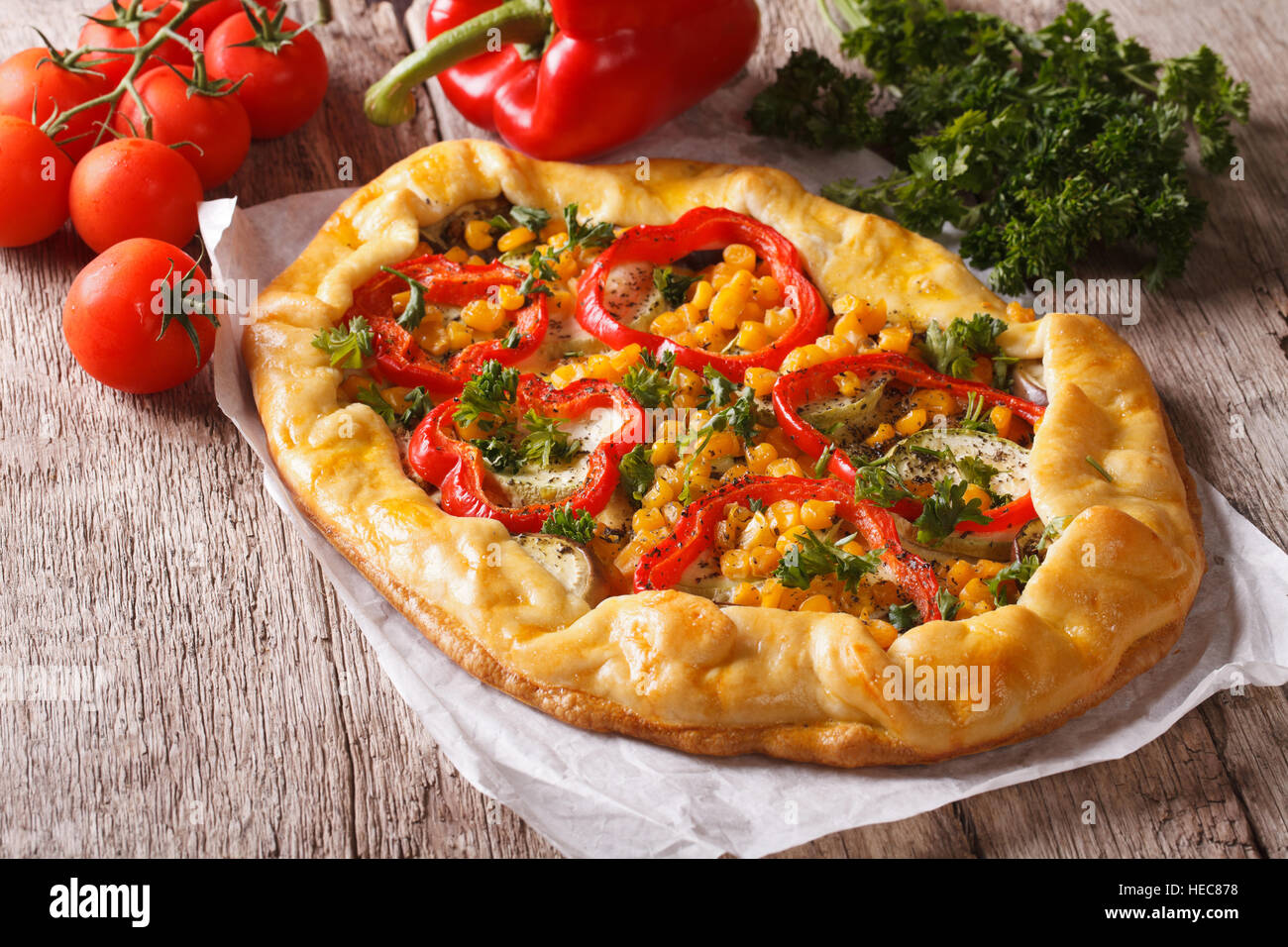 rustic vegetable pie on a table close-up and ingredients. horizontal Stock Photo
