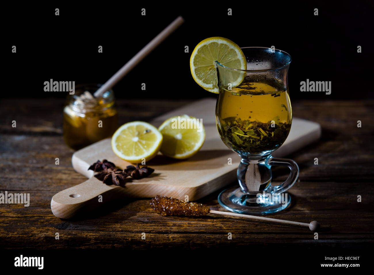 Natural medicones against flue and cold. Honey, lemon, hot tea, onion and garlic. Health concept. Stock Photo