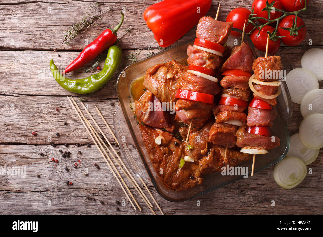 Preparing food for cooking barbecue on skewers. horizontal view from above, rustic Stock Photo